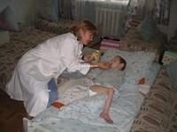 Angela makes it a priority that this ill child gets some food.