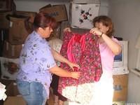 Some of the ladies sort through clothing that will be distributed to the church and community.
