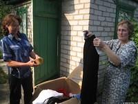 Zhenya and Lyuba sort through clothes.