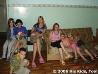 Teens talk on the sofa.