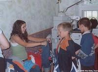 Haley helps size the smaller boys.