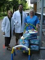 Dallas and Ashley  present some of the donations to hospital staff.