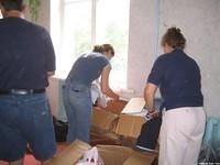 Setting up for clothing distribution.  We are glad that we had 9 sets of hands.