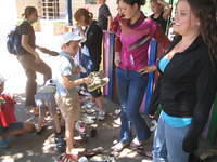 At the Dzerzhinsk Orphan Shelter, children choose shoes.