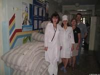Hospital Administrator and her assistant were speechless with their gifts of new mattresses.