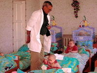 Walter makes a point to visit with each child.