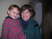 Executive Board member, Lynn A. shares a hug with this little girl.