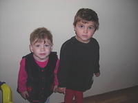 These 2 little girls await their turn for the restroom.