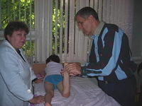At the Orthopedic Hospital, Kevin M. checks on some of the children there.