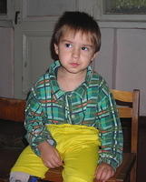 This shy boy wanted his photo taken, but just would not smile.