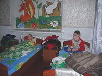 It was nap time, and kids piled their clothing up next to their bed space.