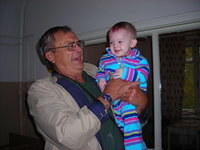 This baby enjoys a hugs from Walter.