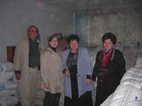 Walter, Teresa and Internot director and staff stand with the donation.