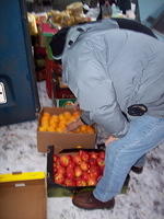 Rich very carefully chose fruit from the market.