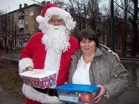 Here, the director enjoys having her photo with Santa.
