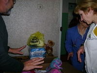 After 'box' distribution we set out to visit the facilities with babies. Here the head nurse, is looking at the aid.