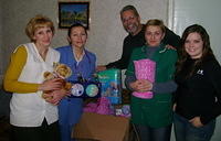 Children's ward director, head nurse, and floor nurse all with Rich and Lydia show off their gifts for the facility.