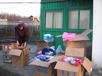 Before distribution, boxes are sorted by clothing sizes, and facility needs.