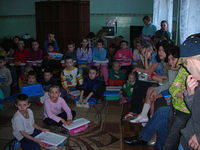 Kids anxiously wait to open their boxes till everyone has one.
