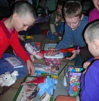 Boys look at all the items and then they trade.