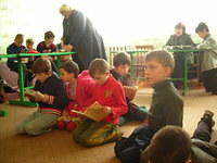 Children and workers enjoy the song time.