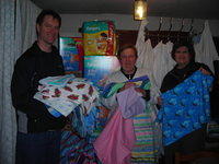 Ray and Lynn show some of the great donations by Frieda, her sisters, and the folks at Millbrook. Presbyterian.