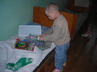This boy carefully removed and organized his box.