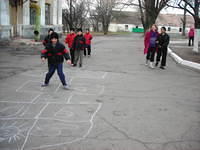 The kids play hop-scotch.  While waiting to go to dinner.