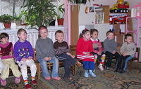 The kids listen intently.
