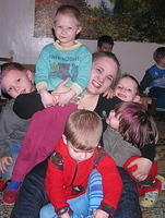 Christine has fun with the kids.