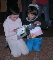 These young girls inspect their personal care bags.