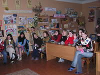 Teen girls wait for clothing, while...