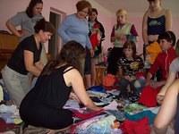 Pam helps sort for clothing to fit the older kids.