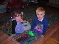 These 2 boys like playing 'cars'.