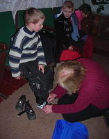 Jayne fits new shoes on Roman.