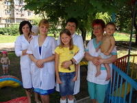 Alla is shown here with the director and some of her former caregivers.