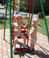 The children have clothing, but due to the heat, caregivers allowed children to play in their underwear.