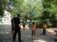 Mark, Natalia, Anna and Haley use a simple beach ball to entertain the kids