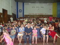 The kids wait patiently for the concert to begin.