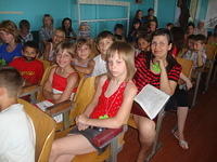 Kids wait patiently for the concert to begin.