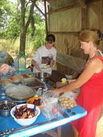 Teresa gets some help from Dasha with the food.