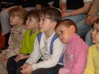 Precious kids wait for their turn to visit with Santa.