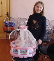 The girl was thrilled to receive this huge doll and bed.
