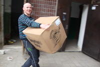 Church members help with boxes.