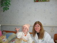 Vika loved her new hat, thanks to H. Little.