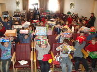 Kids hold up their boxes.