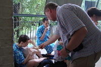 Greg hands out bananas and cookies.