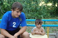 Johnny takes the time to visit with this little boy.