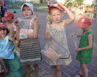 The little ones and their new dresses and care bags.