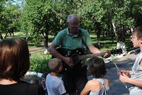 Ted plays a song for the kids
